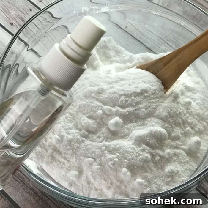 Tea Tree Acne Facial Tabs — Lush-Inspired Acne Treatment 6 adding witch hazel from clear spray bottle to essential oil facial steamer tab mix of ingredients baking soda citric acid tea tree essential oil