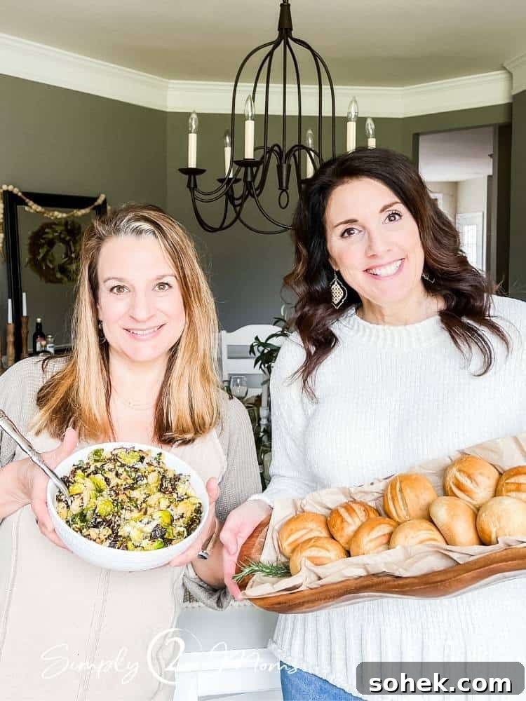 Stunning Italian Dinner Party Menu Ideas to Impress Your Guests 3 Two bloggers holding a wood bowl with fresh rolls and a serving dish of Brussel Sprouts for an Italian themed dinner party