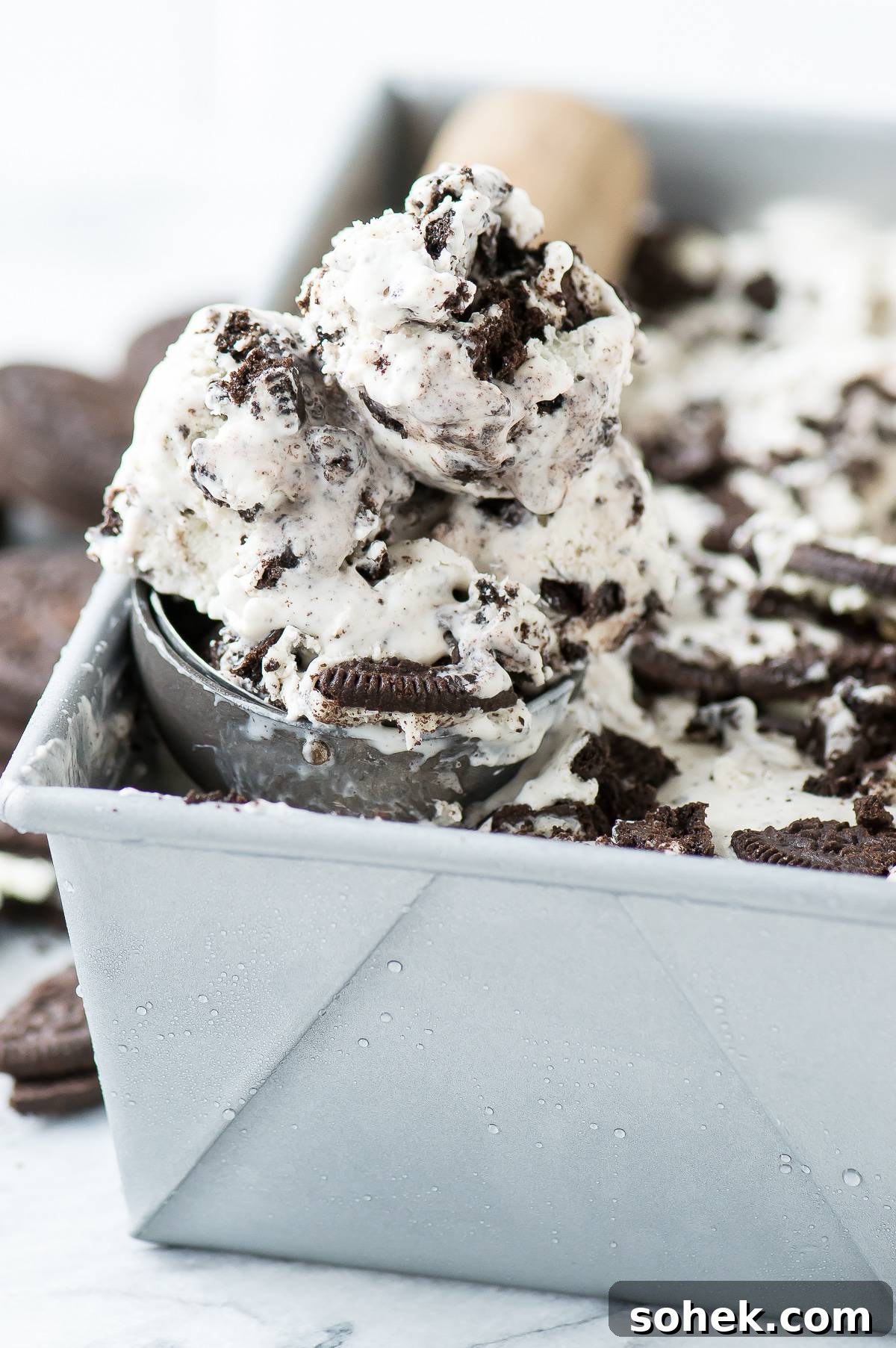 3 ingredient Oreo Ice Cream - the easiest no churn oreo ice cream recipe! ice cream scoop full of oreo ice cream