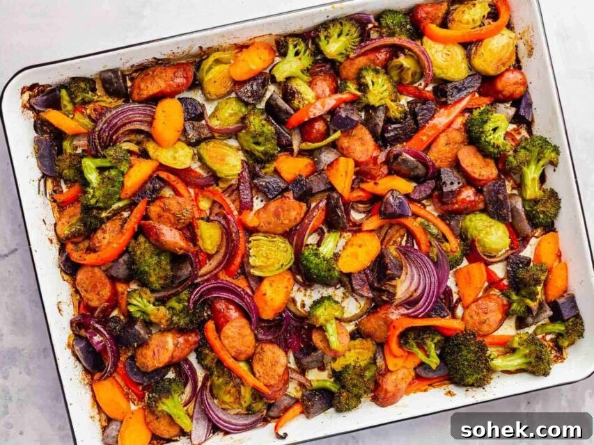 Sheet Pan Sausage and Roasted Vegetables with Herbs 14 A portion of roasted sausage and vegetables on a sheet pan.