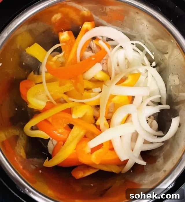 Keto Low-Carb Instant Pot Chicken Fajitas 4 chicken fajitas in instant pot peppers onions