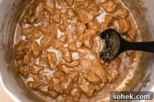Greggs-Style Steak Bake Recipe: How to Make It at Home 12 Cooling down the steak bake filling in a large silver pot