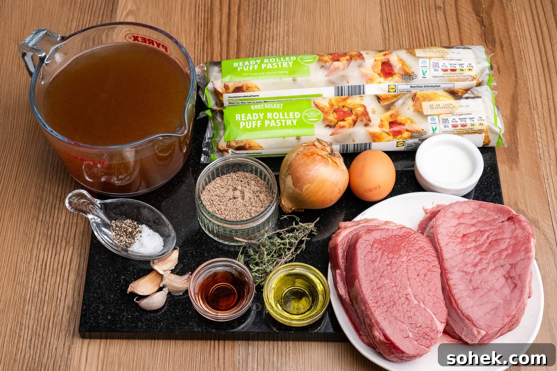 Greggs-Style Steak Bake Recipe: How to Make It at Home 21 Four stewing steaks,Two packets of rolled puff pastry, one onion, one egg, milk, olive oil, red wine vinegar, garlic cloves, sprigs of thyme, gravy granules, salt, pepper and beef stock in a jug