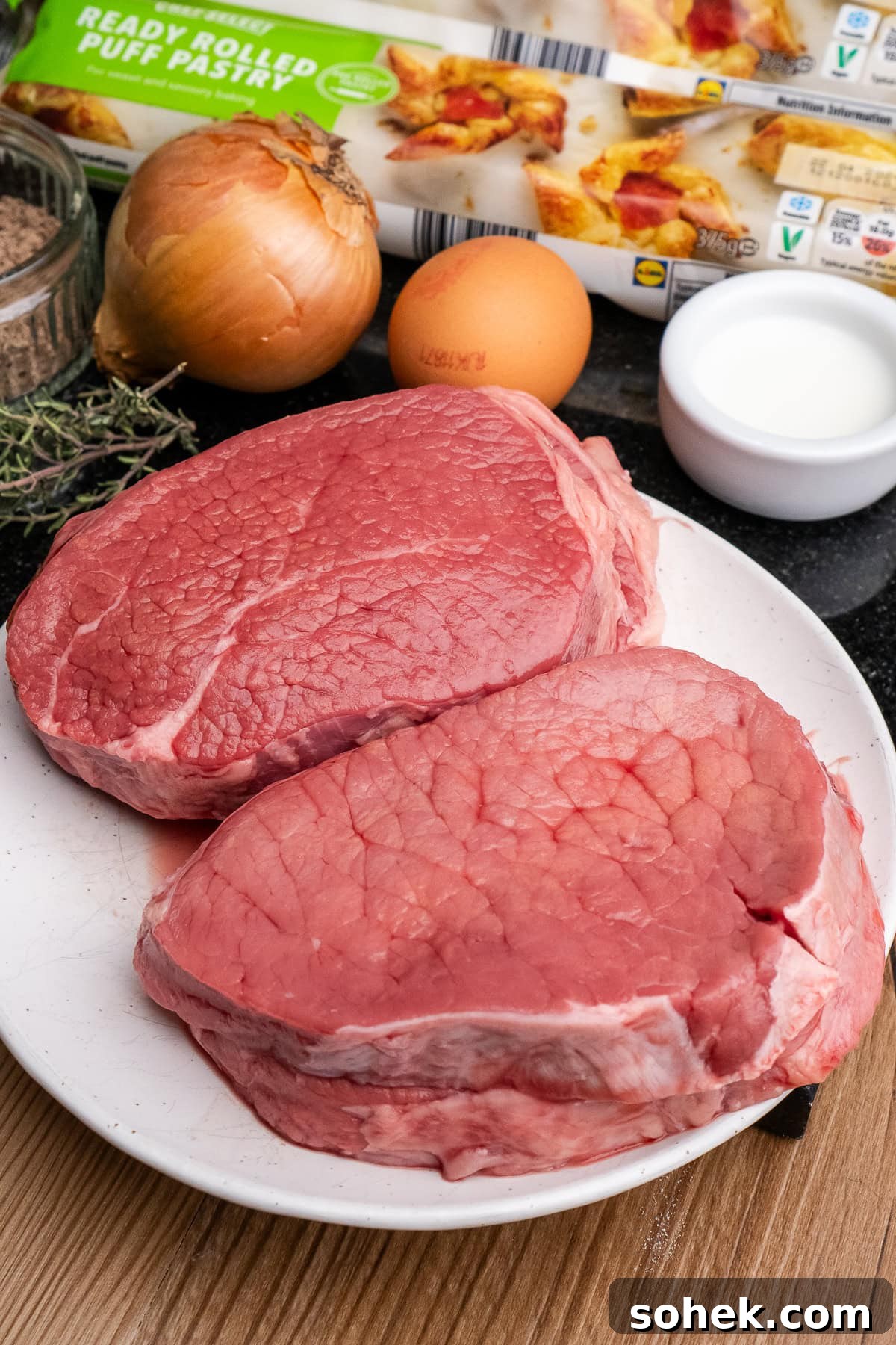 Greggs-Style Steak Bake Recipe: How to Make It at Home 22 Four stewing steaks on a white plate