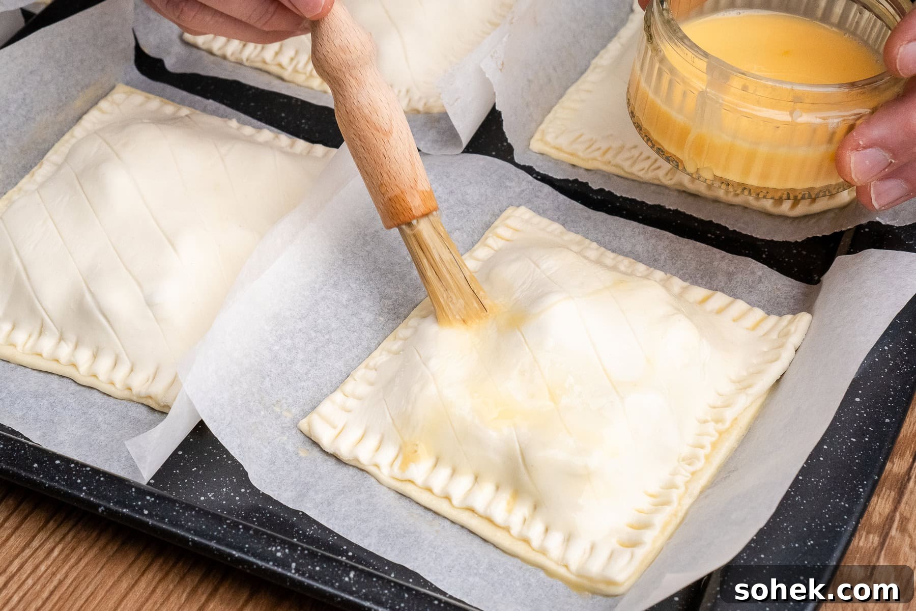 Greggs-Style Steak Bake Recipe: How to Make It at Home 38 Egg washing the steak bakes with egg wash using a brush