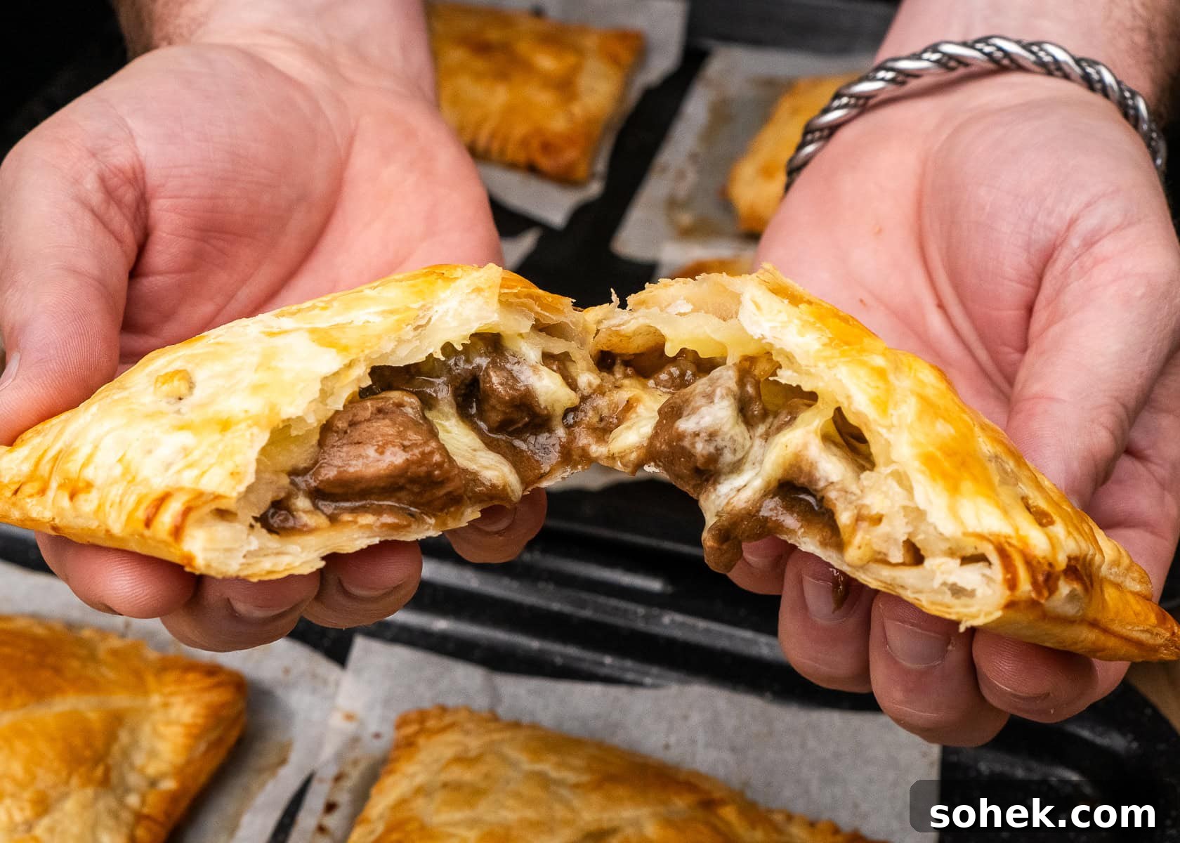 Greggs-Style Steak Bake Recipe: How to Make It at Home 45 Pulling apart a Steak Bake with cheese