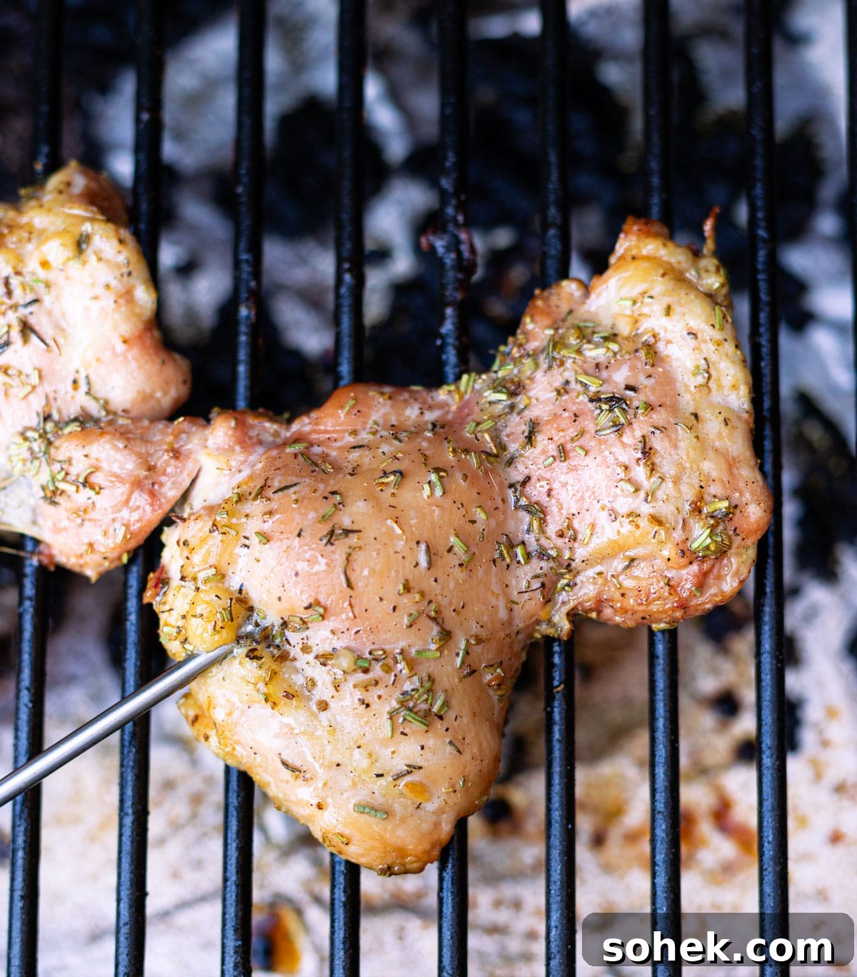 Juicy Smoked Chicken Thighs with Crispy Skin Recipe 9 Chicken thigh with temperature probe on a smoker