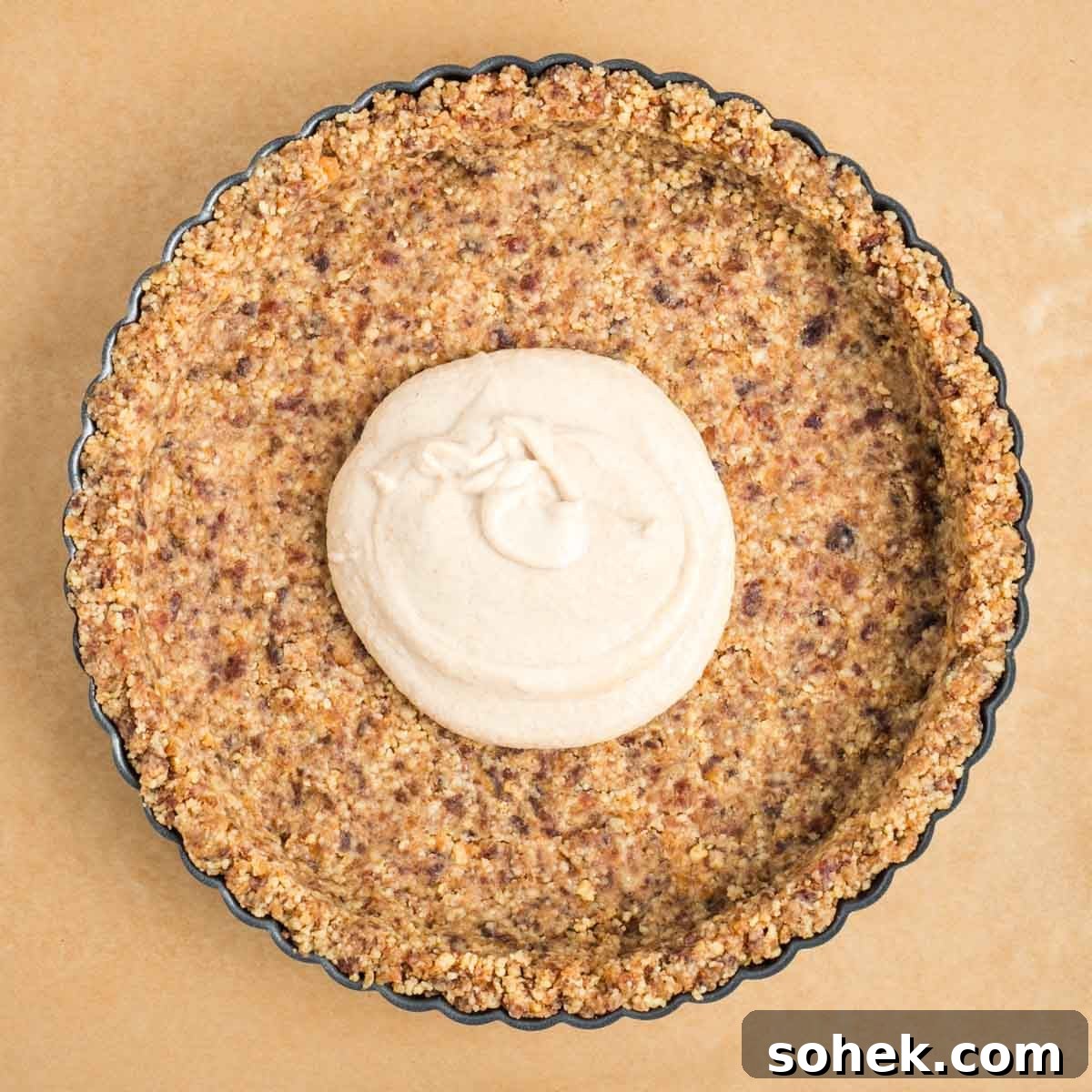 Apple Walnut Tart with Creamy Vegan Cashew Custard Recipe 11 Walnut date crust in a tart pan with creamy custard in the center.
