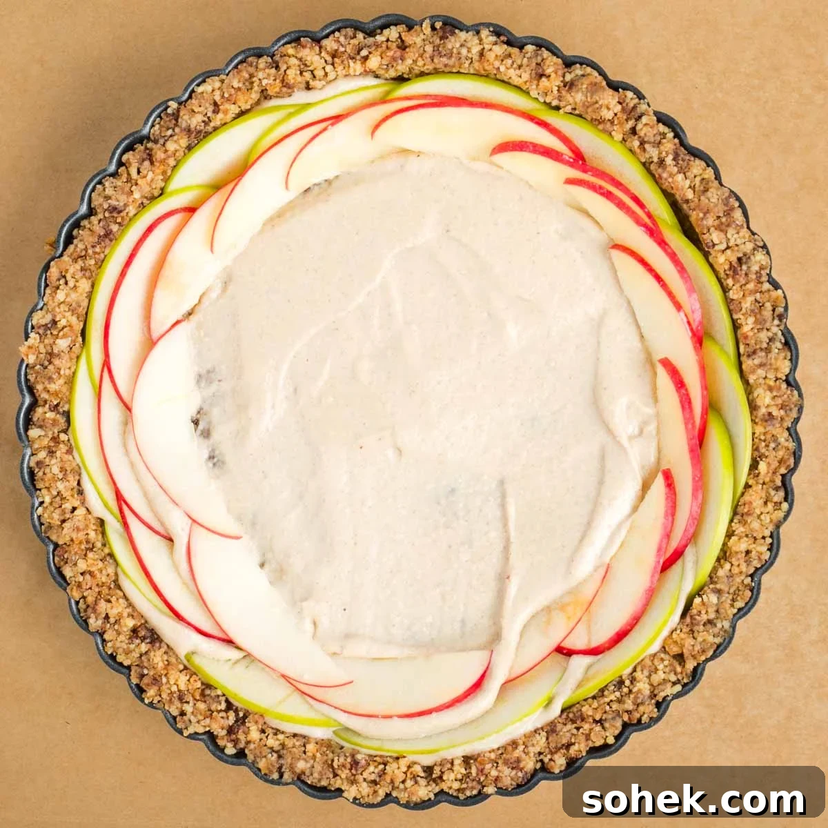 Apple Walnut Tart with Creamy Vegan Cashew Custard Recipe 14 Walnut date tart crust with thin apple slices going around the outer edge along with creamy center.