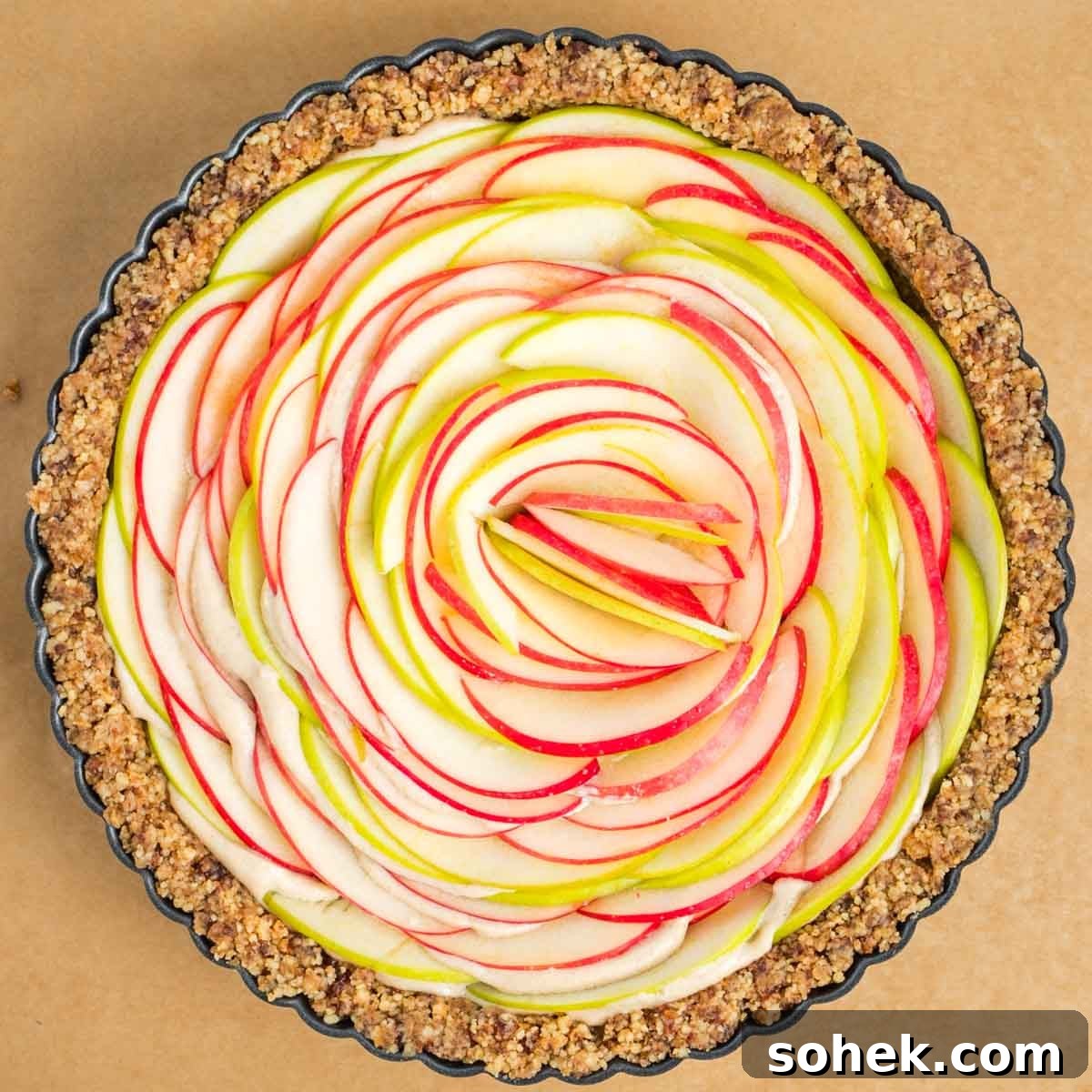 Apple Walnut Tart with Creamy Vegan Cashew Custard Recipe 16 Thinly sliced apples as filling for a walnut tart with vegan cream inside.