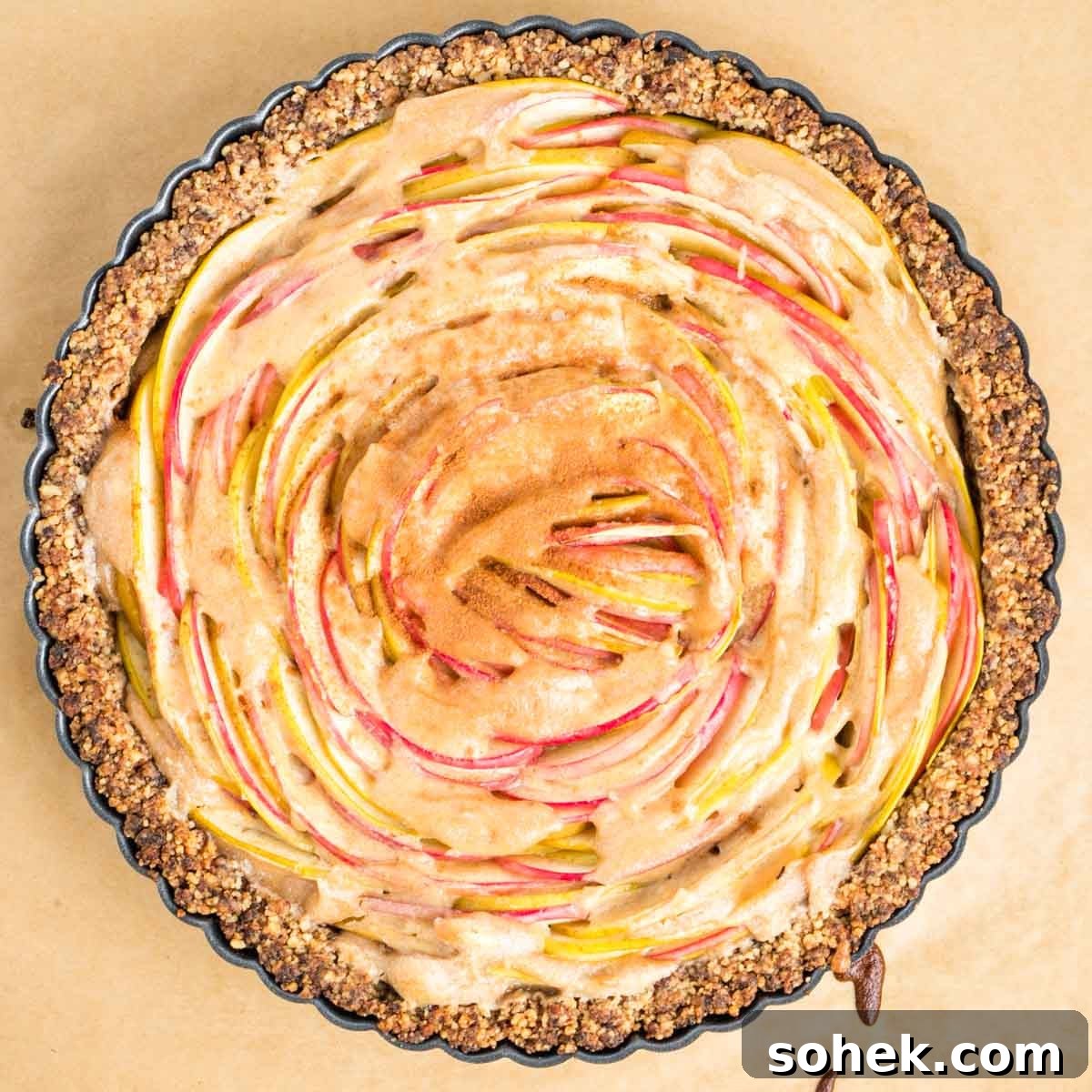 Apple Walnut Tart with Creamy Vegan Cashew Custard Recipe 18 Freshly baked walnut tart crust filled with cream center and thinly sliced apples.
