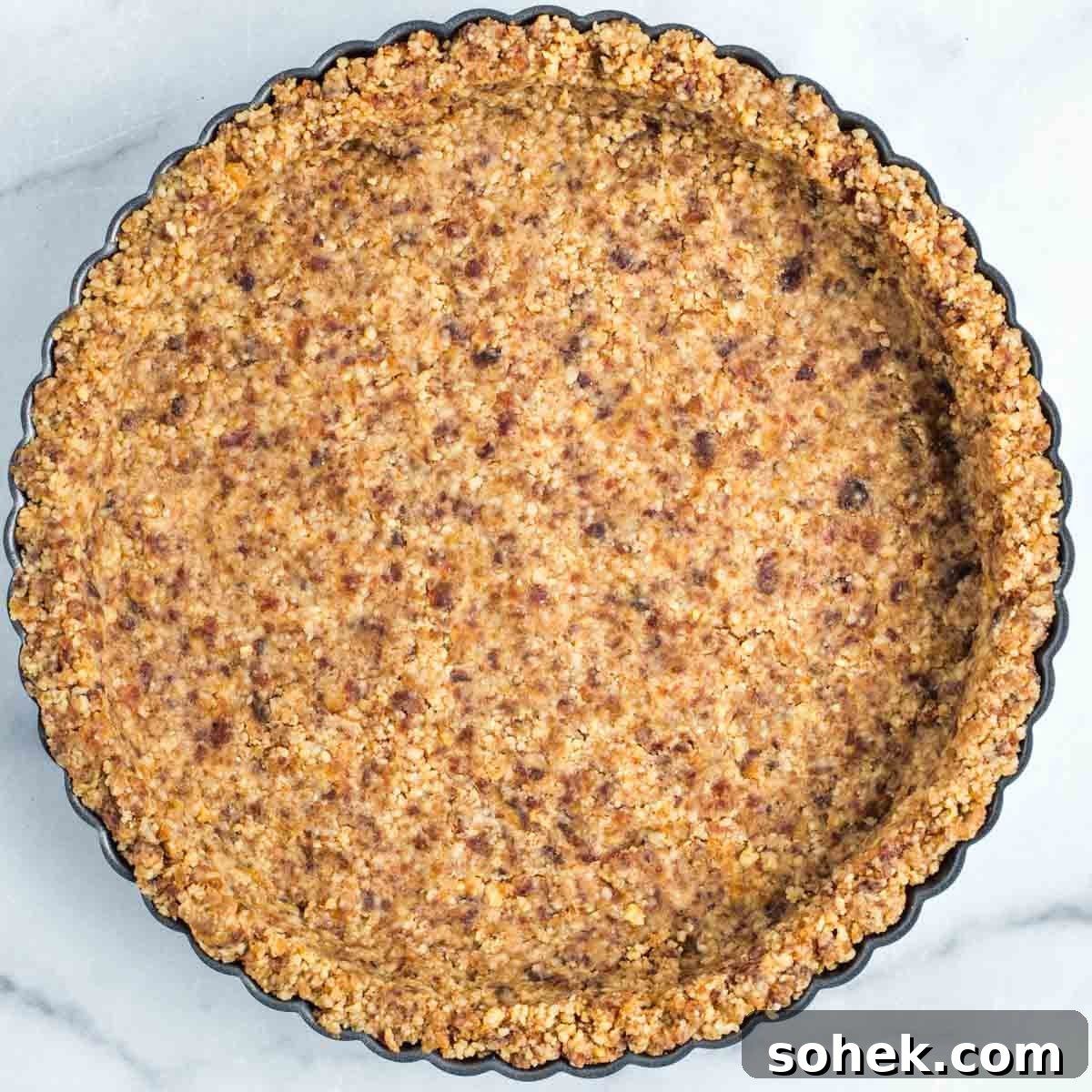 Apple Walnut Tart with Creamy Vegan Cashew Custard Recipe 8 Walnut date crust pressed into a scallop edged tart pan.