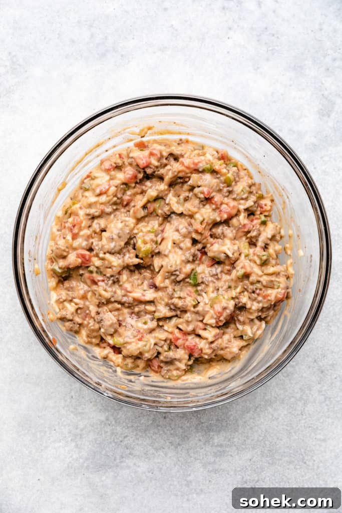 Cheesy Hamburger Rice Casserole Recipe for Comforting Weeknight Meals 6 Ground beef stirred together with casserole filling.
