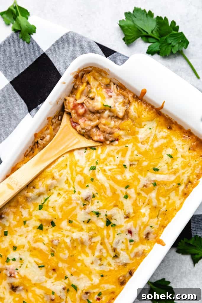 Cheesy Hamburger Rice Casserole Recipe for Comforting Weeknight Meals 9 Top down view of a cheesy casserole with rice and ground beef.