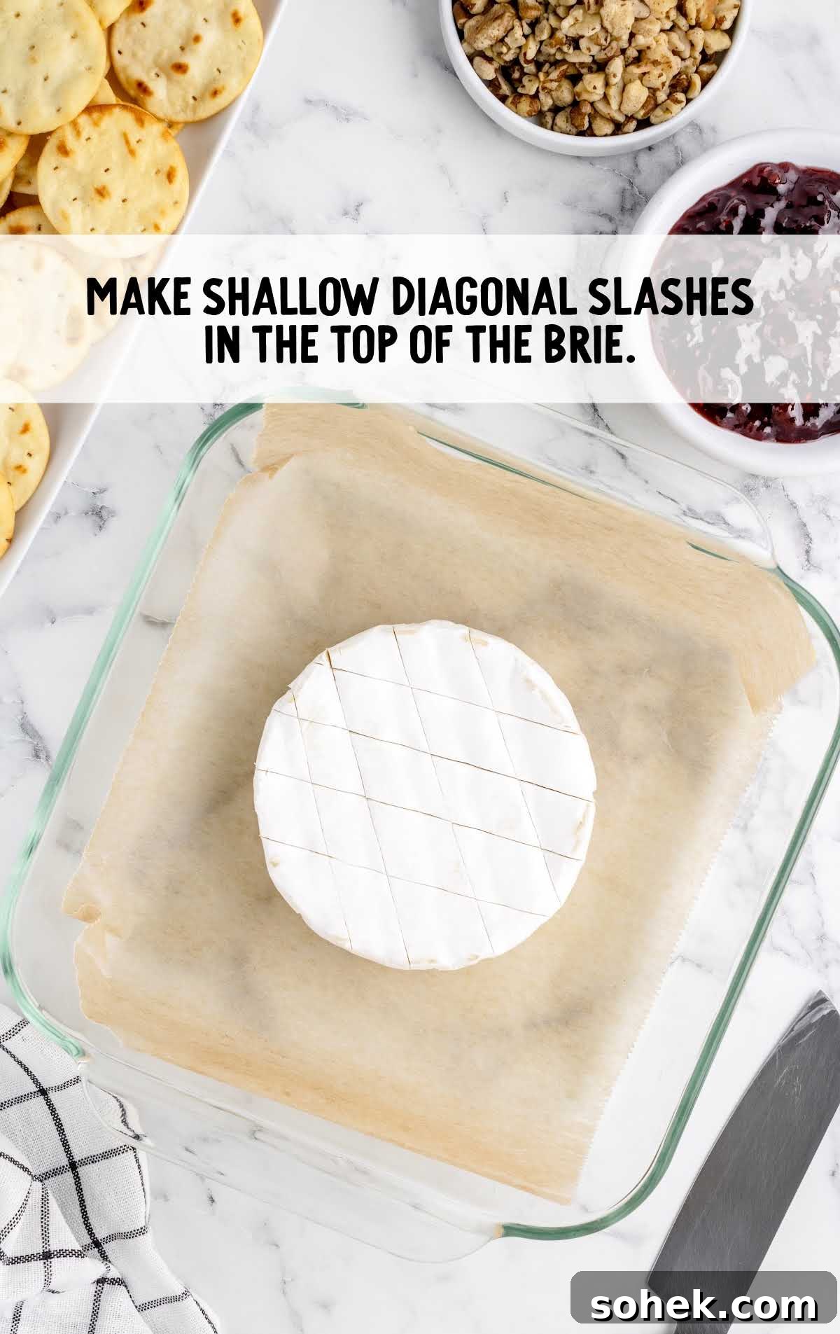Baked Brie with Jam: Gooey Appetizer Recipe for Entertaining 4 diagonal dashes cut in the top of the baked brie