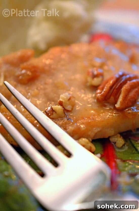 Honey-Pecan Glazed Pork Chops with Crispy Edges 5 A close-up of a plate of food, with Pork and Pecan.
