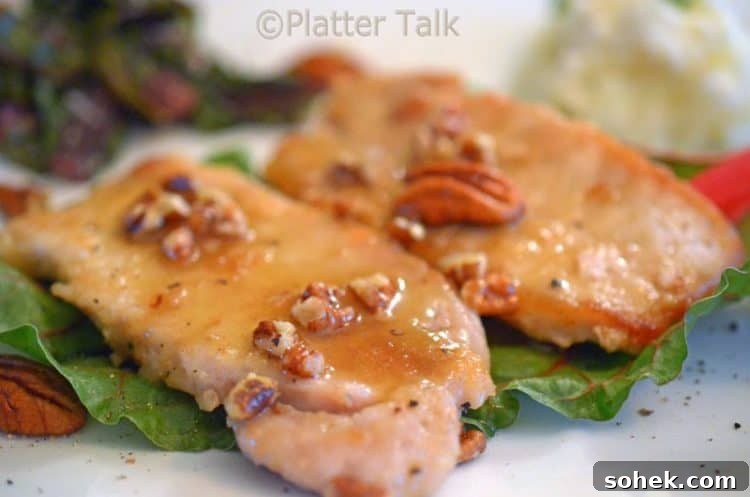 Honey-Pecan Glazed Pork Chops with Crispy Edges 6 A close up of a honey pecan pork chop