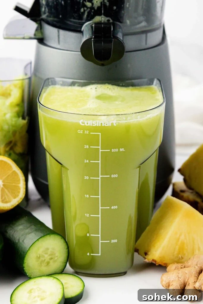 pineapple cucumber juice in a juicing canister