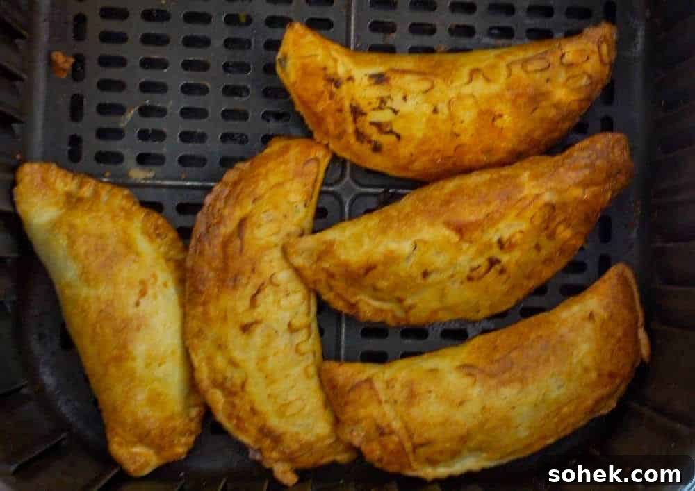 Crispy Air Fryer Empanadas: Homemade Recipe for Perfect Filling 7 cooked empanadas in air fryer