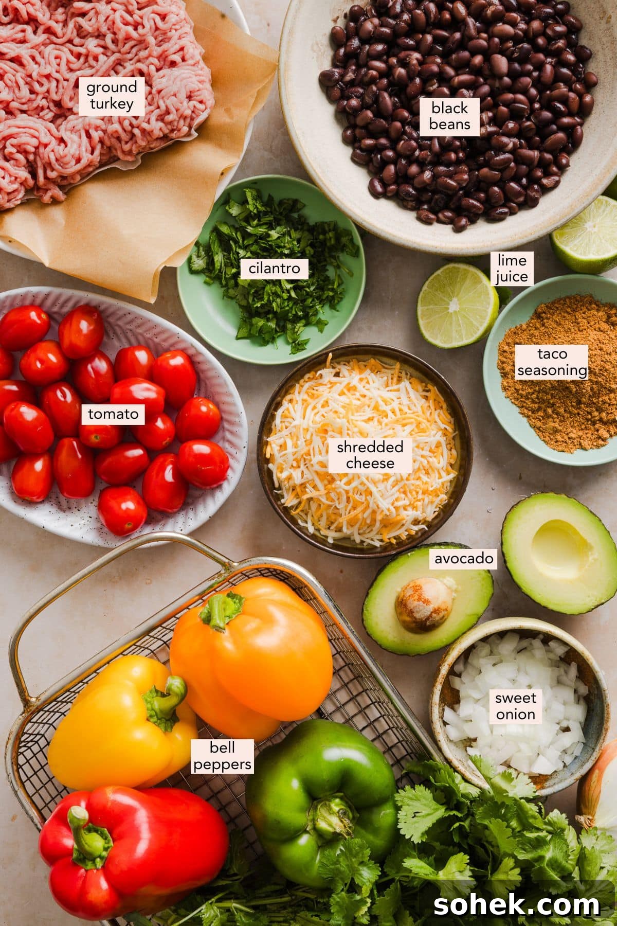 Bell pepper nachos made with nutritious ingredients like bell peppers, lean meat and beans and topped with your favorite nacho toppings. Ingredients for bell pepper nachos on a countertop with labels.