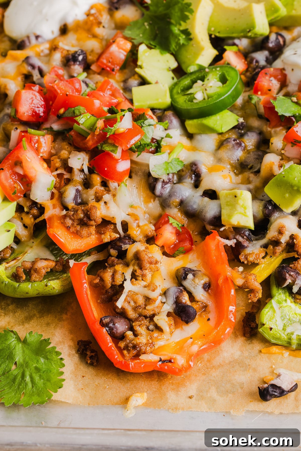 Loaded Bell Pepper Nachos: Flavor-Packed Low-Carb Nacho Bake 7 Bell pepper nachos with ground taco meat and toppings.