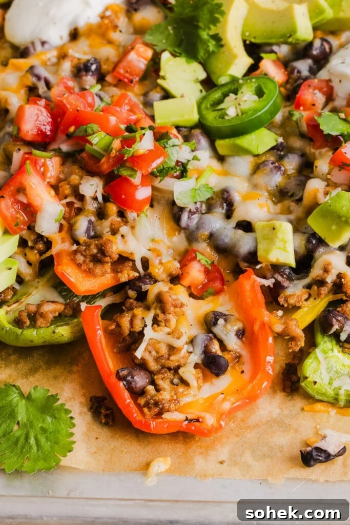 Loaded Bell Pepper Nachos: Flavor-Packed Low-Carb Nacho Bake 8 Bell pepper nachos with ground taco meat and toppings.