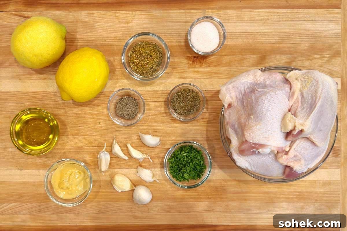 Greek Lemon Roasted Chicken Thighs with Garlic and Oregano 4 Greek Lemon Chicken Thighs ingredients shot on a board