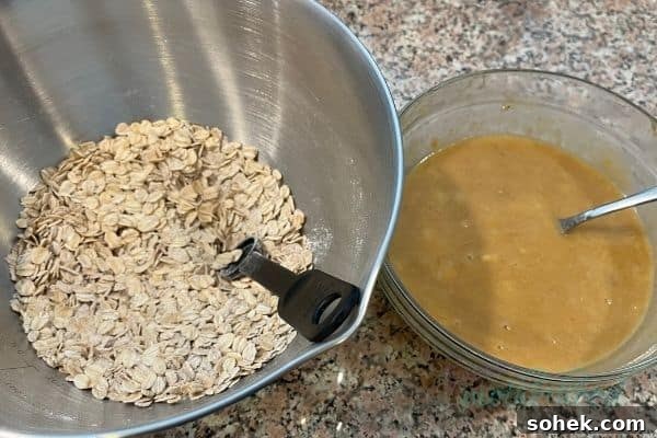 Soft-Baked Peanut Butter Banana Oat Bars for Snacks and Lunch 4 Two bowls, one with dry ingredients mixed, the other with the mixed wet ingredients