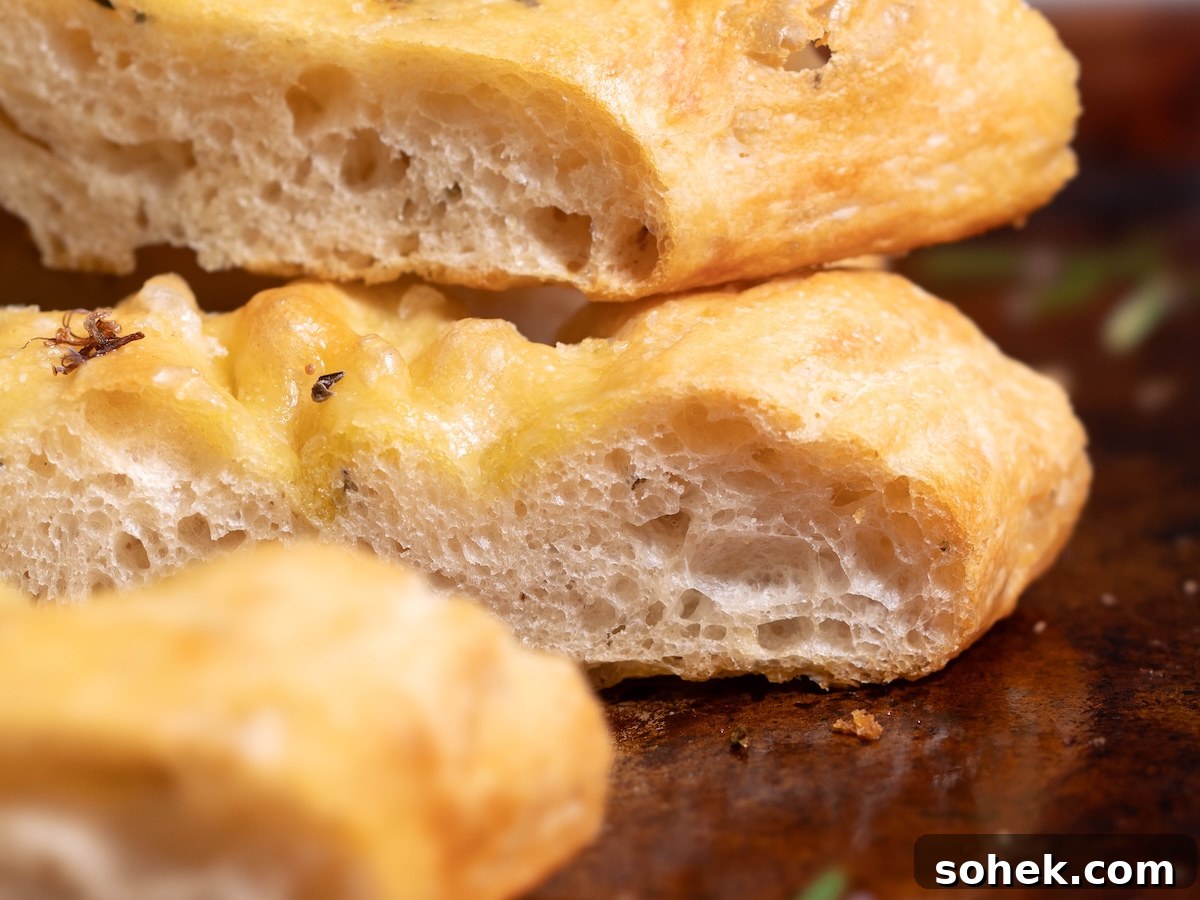 Crispy Sourdough Discard Focaccia with Olive Oil and Herbs 13 Slices of focaccia up close