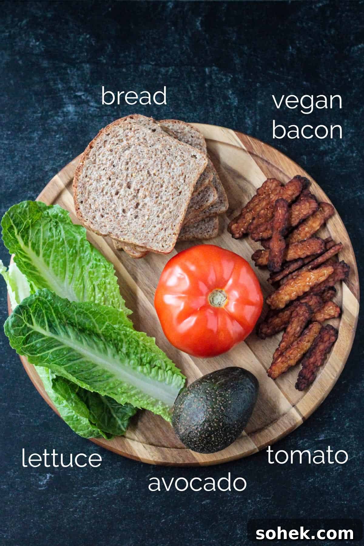 Crispy Vegan BLT Sandwich with Smoky Tempeh Bacon 3 Recipe ingredients arrayed on a round serving tray.