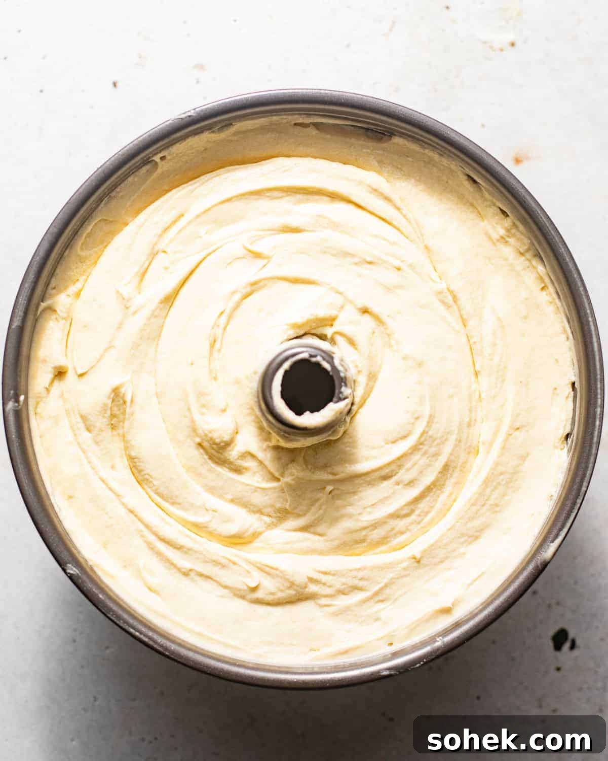 key lime pound cake batter in a tube pan.