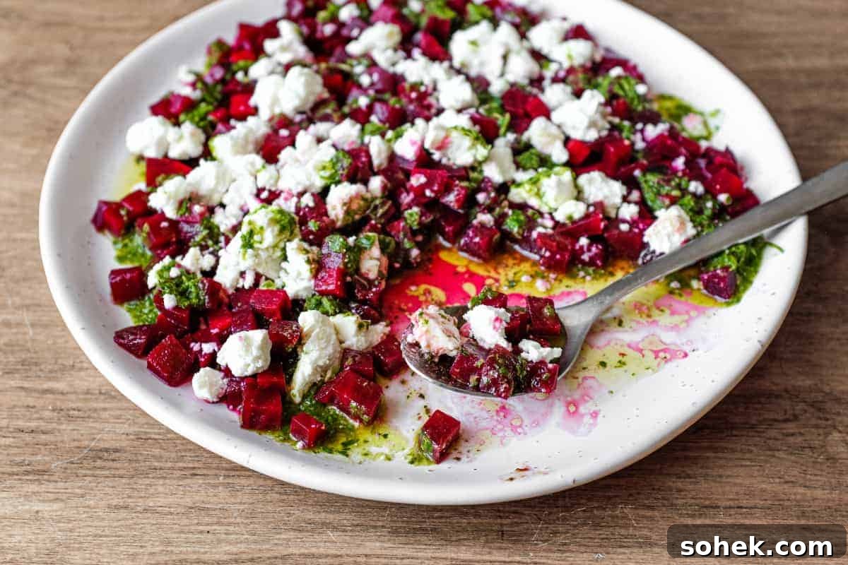 Roasted Beet & Feta Salad with Fresh Herb Vinaigrette 2 A platter of beetroot & feta salad with a herb dressing