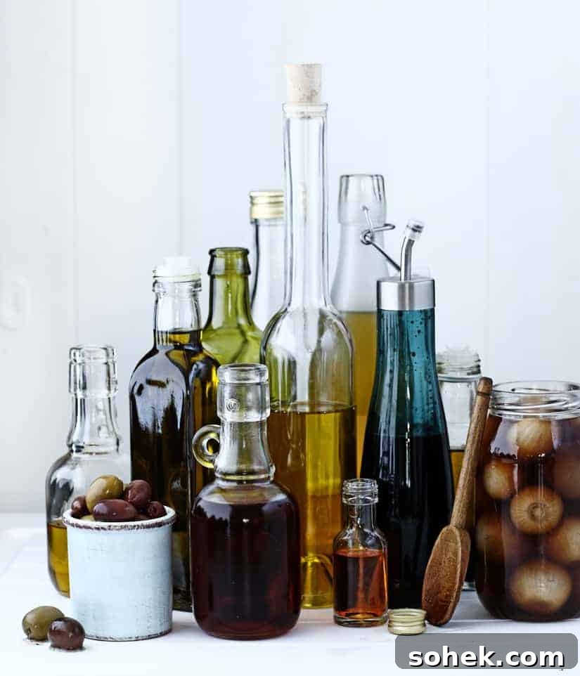33 Essential Oils and Vinegars | cookeatworld.com A selection of glass bottles holding oils and vinegars
