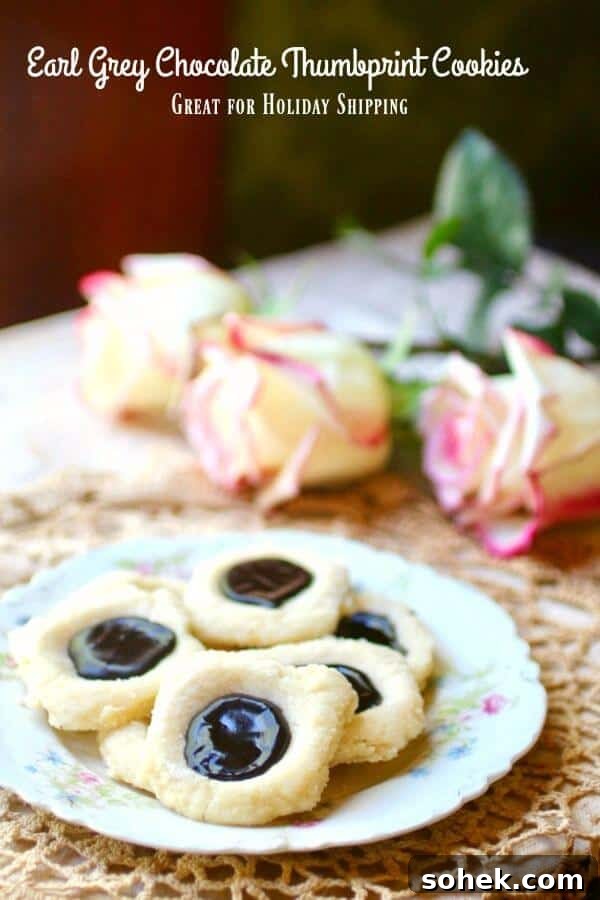 Earl Grey Chocolate Thumbprint Cookies — Perfect for Shipping 2 Earl Grey chocolate thumbprint cookies are buttery cookies with a dark chocolate center. From RestlessChipotle.com