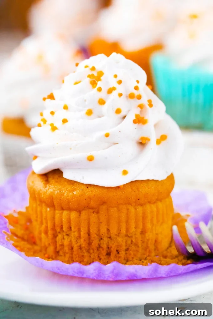 Creamy Sweet Potato Pie Cupcakes Recipe for Fall Desserts 2 Sweet potato pie cupcake topped with whipped cream.