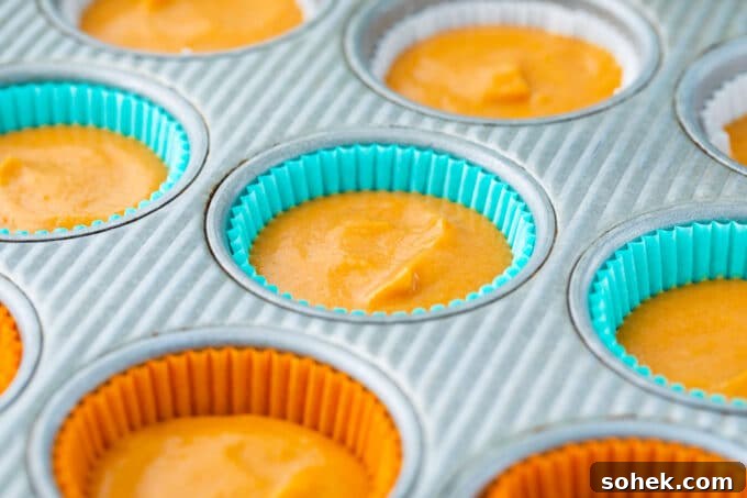 Creamy Sweet Potato Pie Cupcakes Recipe for Fall Desserts 8 Sweet potato pie cupcake batter in muffin tins.