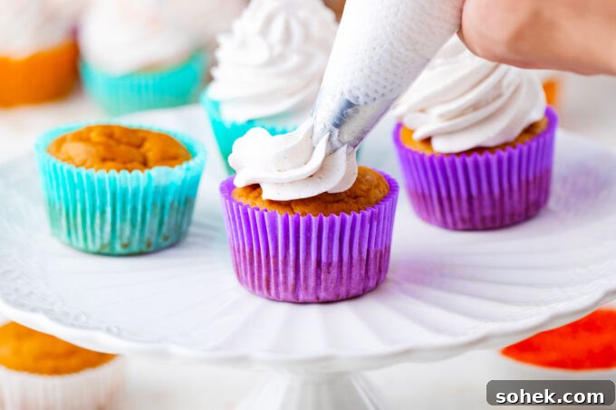 Creamy Sweet Potato Pie Cupcakes Recipe for Fall Desserts 10 Frosting sweet potato pie cupcakes with cinnamon whipped cream.