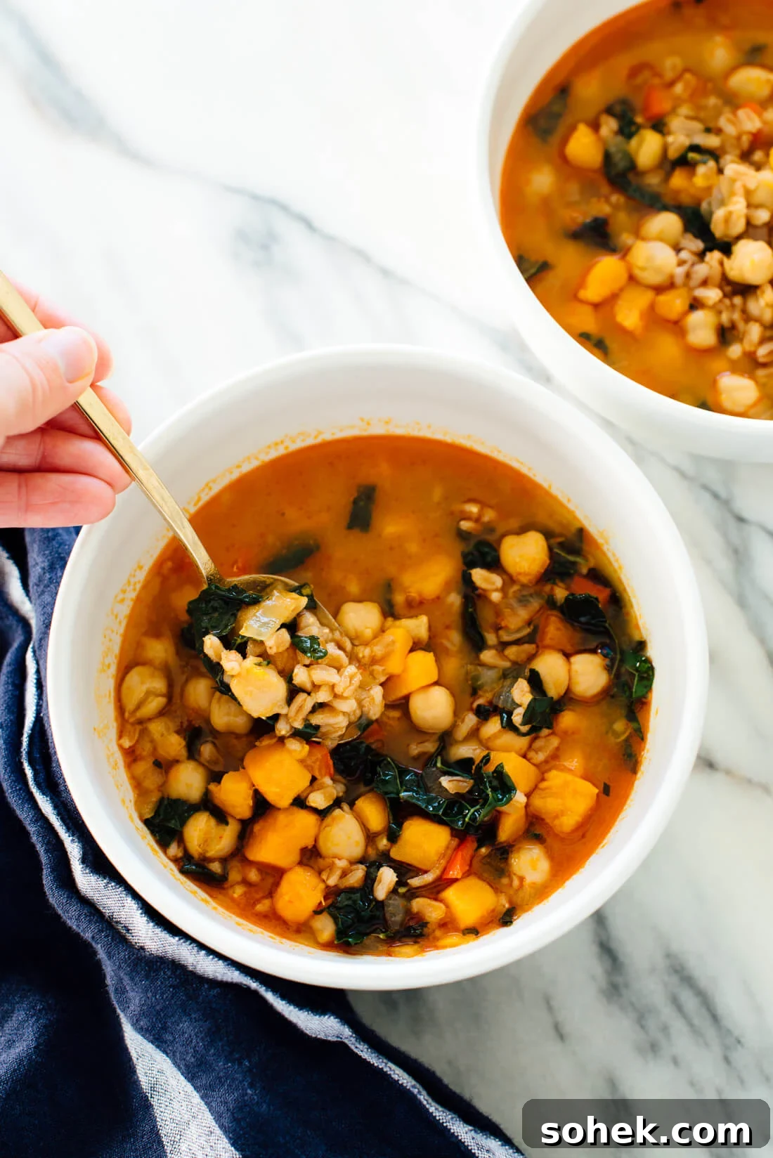 Hearty Sweet Potato, Kale & Chickpea Soup Recipe 2 This healthy #vegan soup recipe is made with sweet potato, kale, farro and chickpeas!