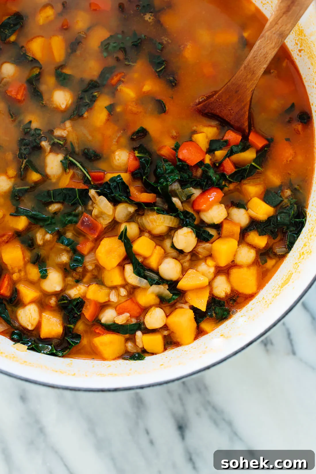 Hearty Sweet Potato, Kale & Chickpea Soup Recipe 5 This hearty sweet potato, kale and chickpea soup with farro will warm you right up. #vegetarian