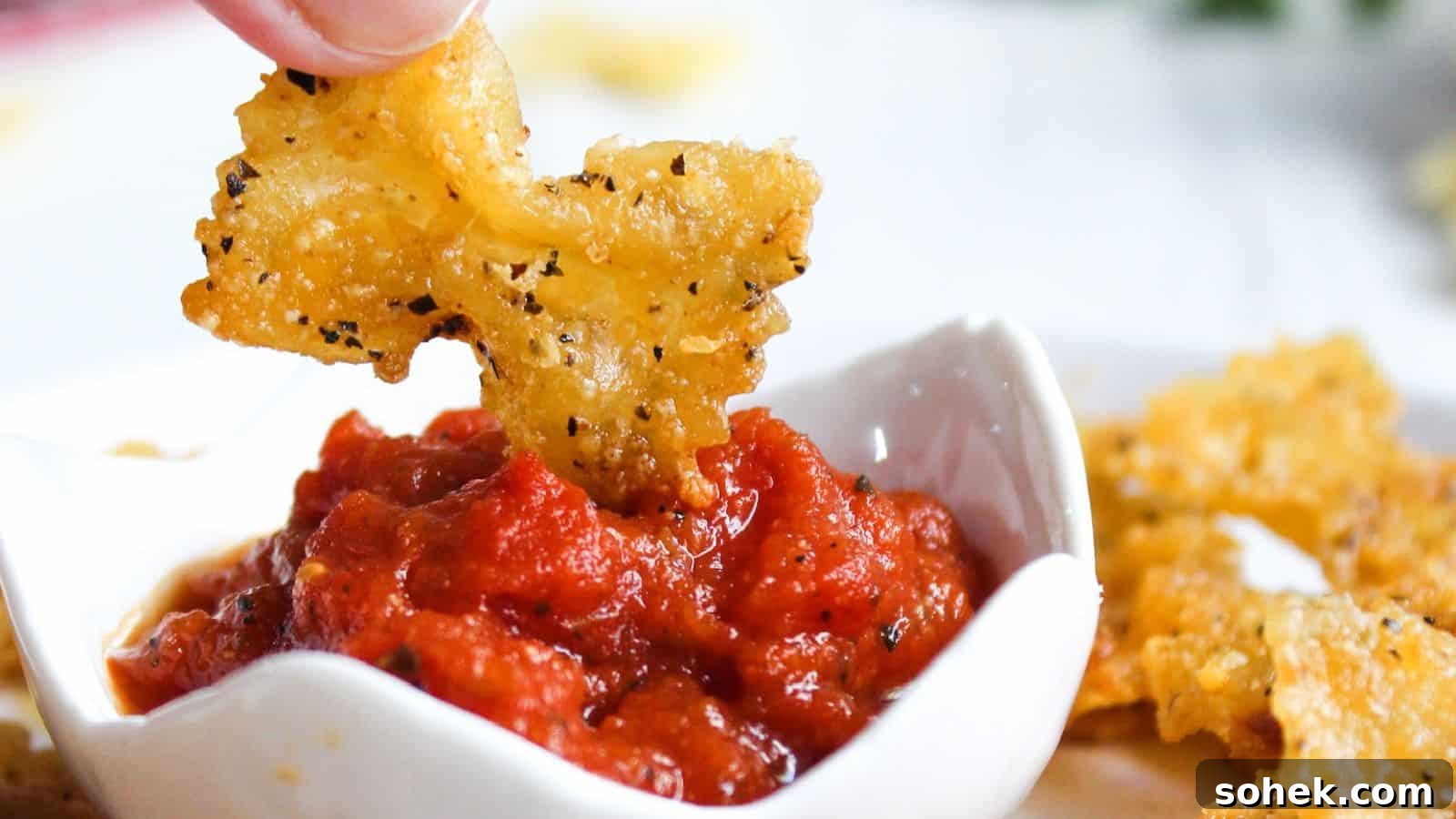 26 Irresistible Air Fryer Game Day Snacks to Serve Guests 14 Pasta chips in a white bowl.