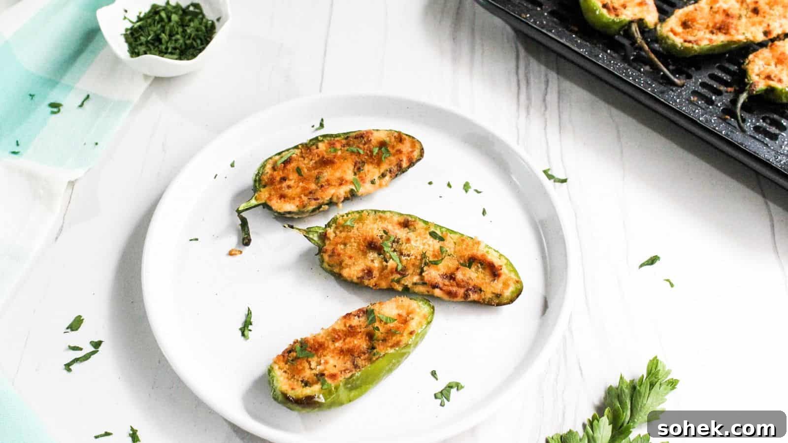 26 Irresistible Air Fryer Game Day Snacks to Serve Guests 17 A plate of jalapeño poppers on a table.