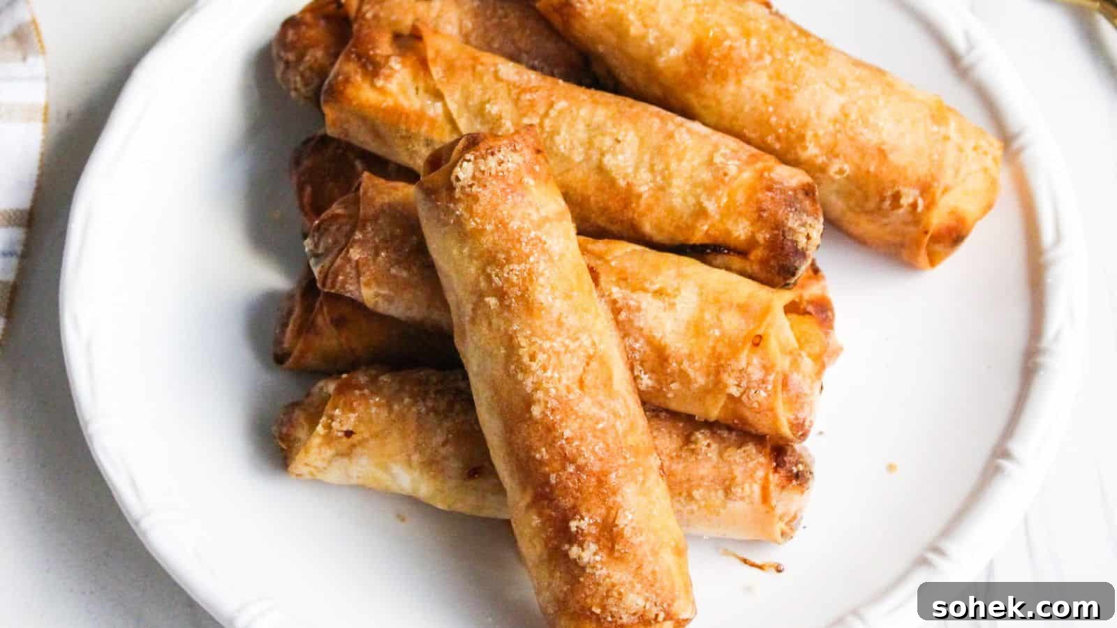 26 Irresistible Air Fryer Game Day Snacks to Serve Guests 24 A plate of freshly cooked Filipino banana turon lumpia spring rolls.