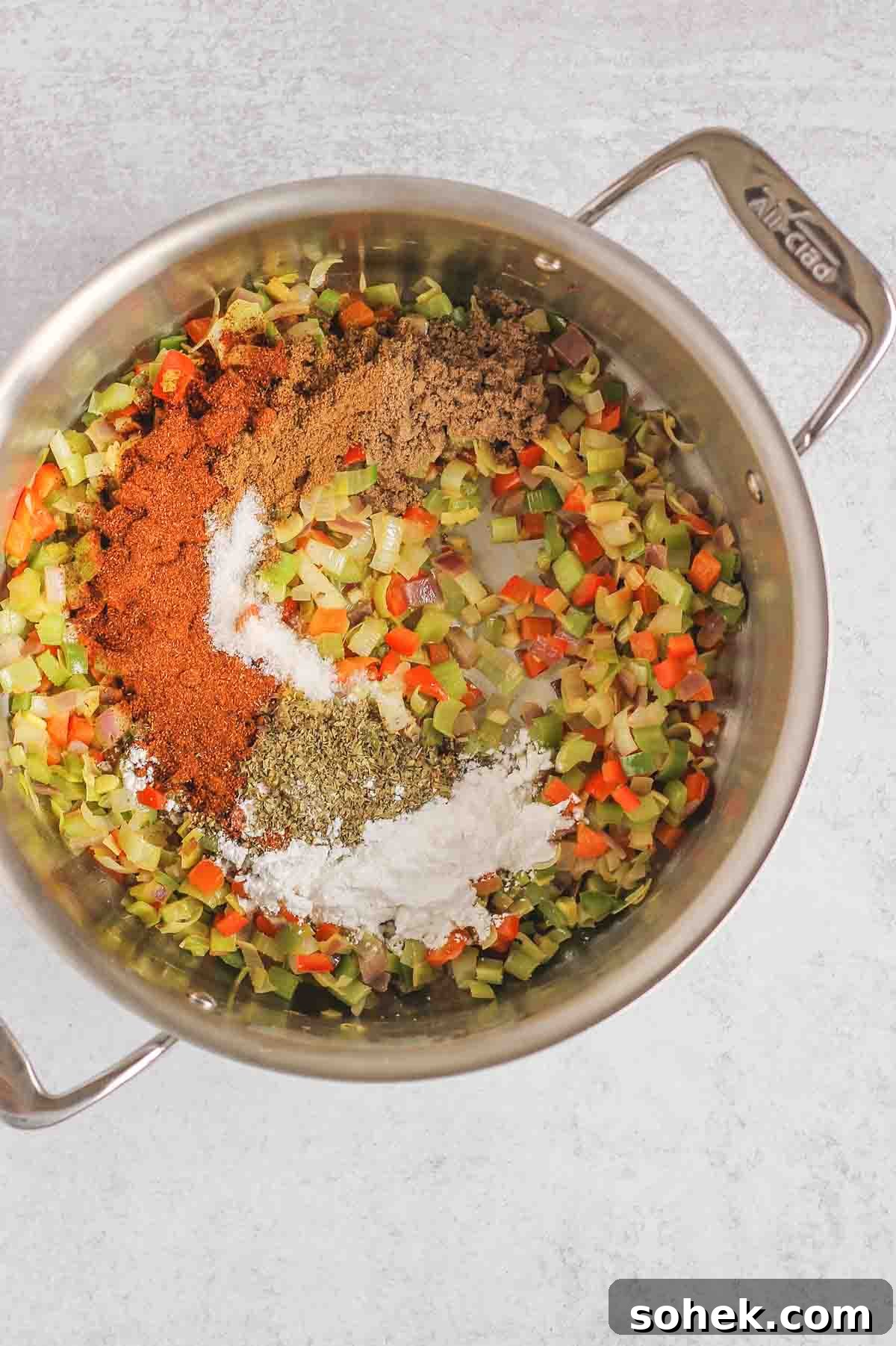 Southwestern Chicken Chili Recipe: Zesty One-Pot Dinner 4 Sauteed veggies and seasonings in a large stainless steel stock pot.