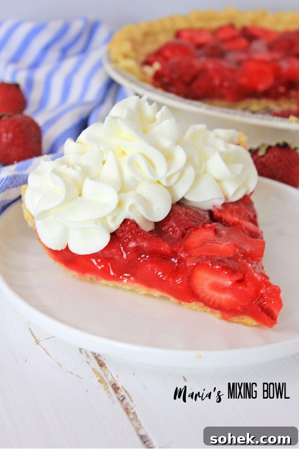 Fresh Strawberry Pie Recipe: Simple No-Bake Summer Dessert 7 Easy Fresh strawberry Pie is in a white plate with a blue and white striped napkin