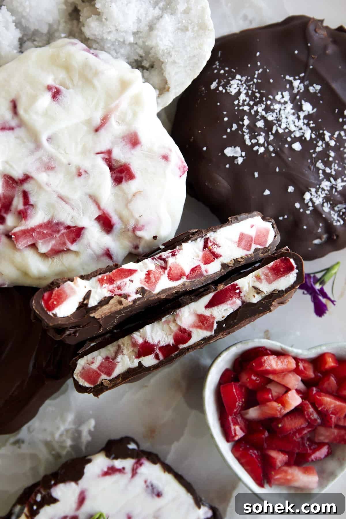 Viral Chocolate-Covered Strawberry Yogurt Clusters Recipe 7 A chocolate strawberry yogurt cluster split in half showing the yogurt center.