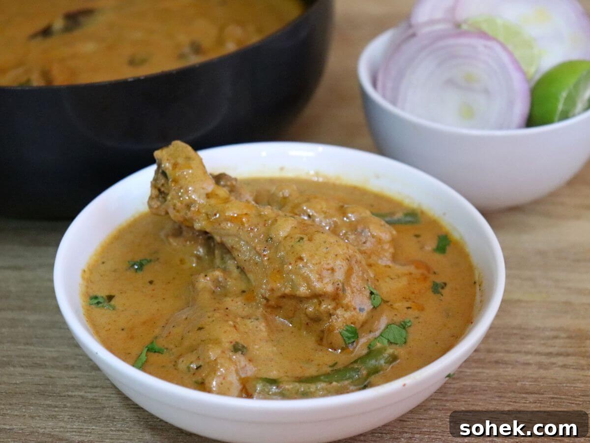 Authentic Mughlai Chicken Curry Recipe: Rich Spiced Chicken Stew 2 close-up of mughlai chicken served in a bowl.