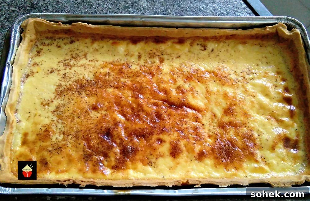 Traditional Egg Custard Tart with a lovely home made pastry and a very silky smooth filling. Serve warm or chilled... I love mine chilled! You can also make mini ones in a muffin pan if you prefer! | Lovefoodies.com