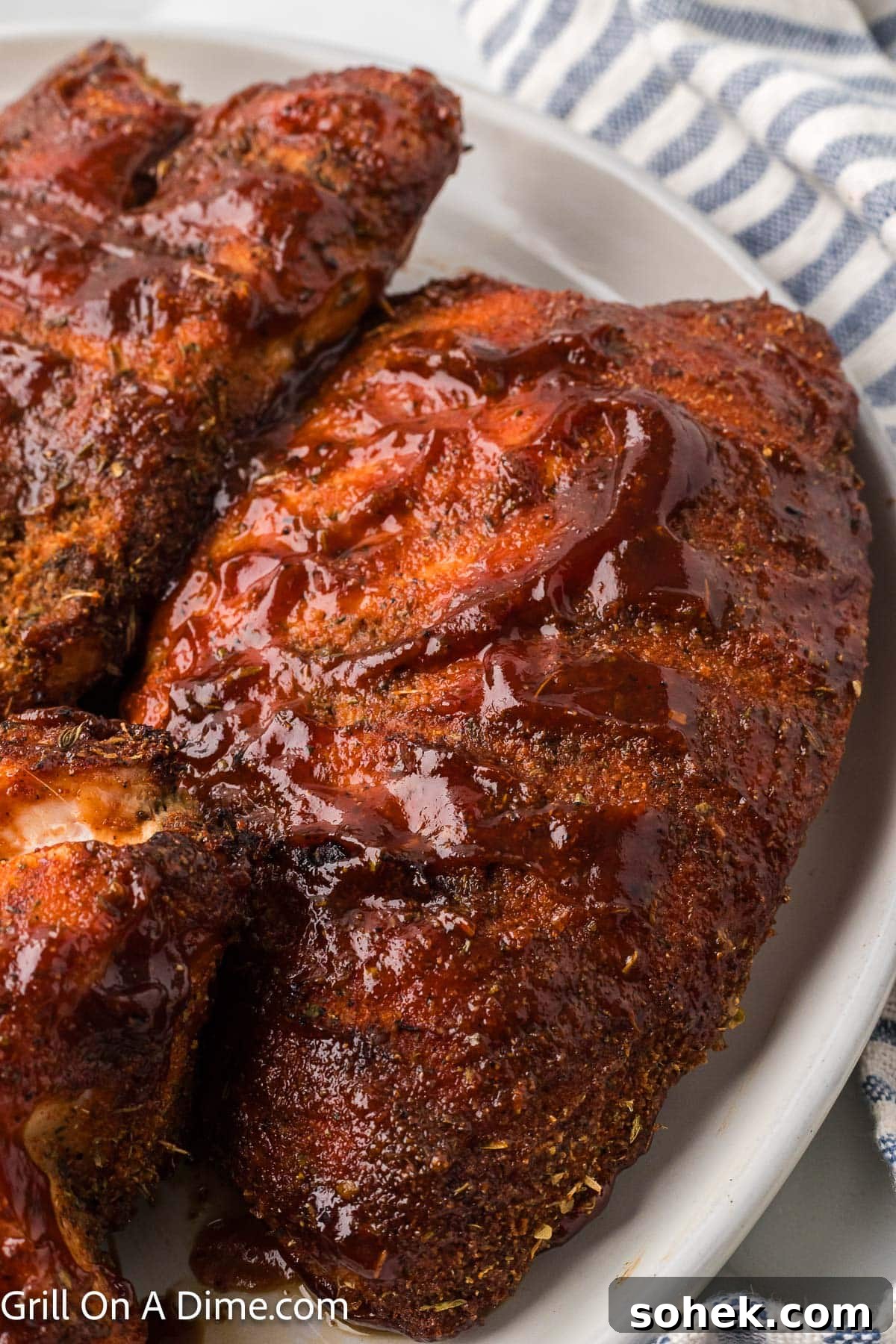 Juicy Grilled Turkey Tenderloin with Garlic Herb Marinade 8 Grilled Turkey Tenderloin on a platter with BBQ Sauce