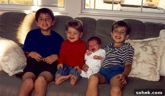 Classic Cosmopolitan Cocktail Recipe: How to Mix a Perfect Cosmopolitan 4 Three young boys on a couch with a baby between them.
