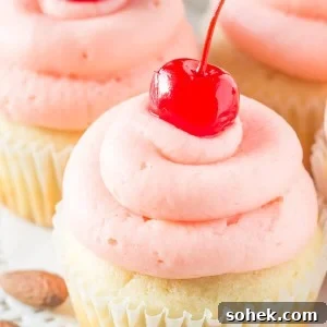 Cherry Almond Cupcakes. Fluffy, moist, super soft almond cupcakes topped with maraschino cherry frosting. www.justsotasty.com